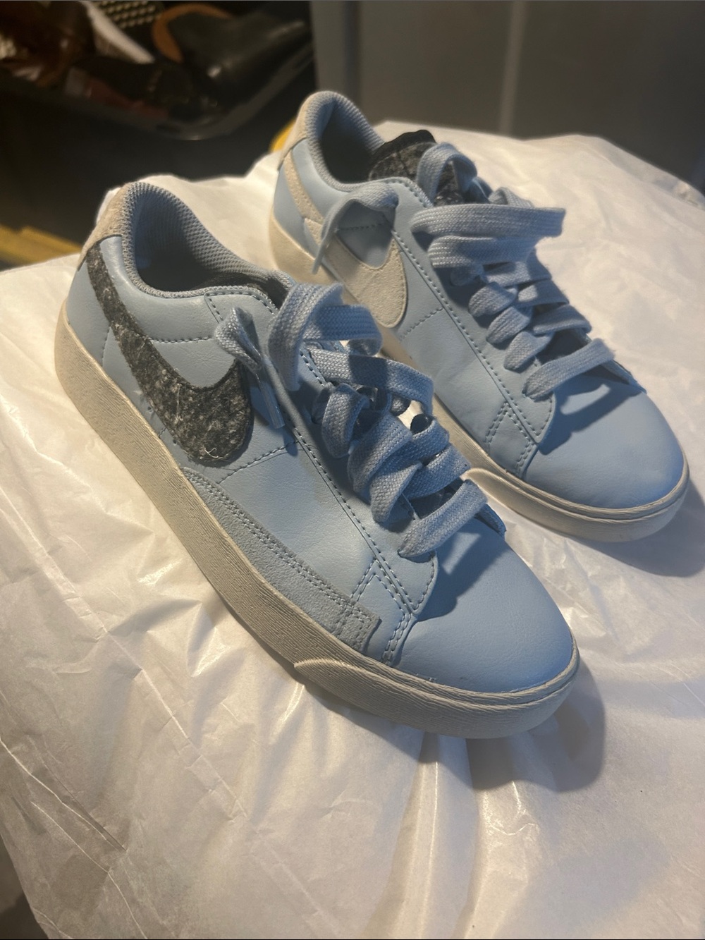 Nike Women's Light Blue Low-Top Sneakers with Black Marbled Swoosh